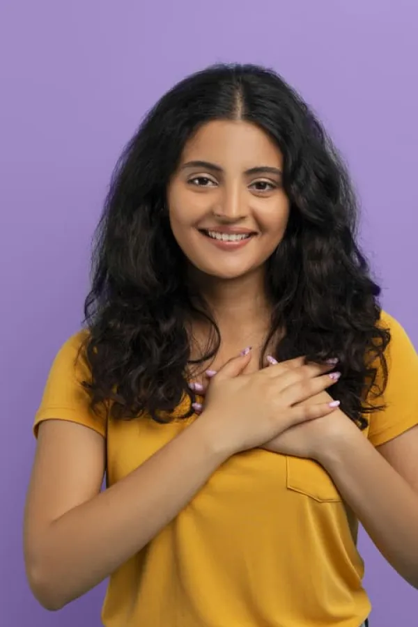 happy young eastern lady holding hands chest (1) (1)